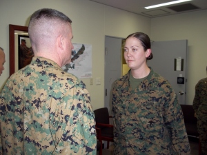 1stLt Catherine Carty reports to Col Andrew MacMannis, Commanding Officer, 31st Marine Expeditionary Unit, during her recent promotion ceremony