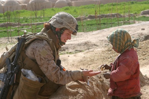Female Marines question an Afghan woman in Helmand province in 2012.